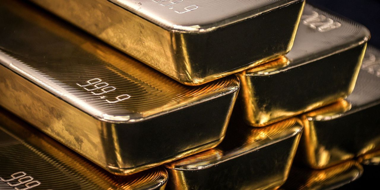 Gold ends higher for the session and week, with the Fed seen as 'less aggressive' on interest-rate hikes