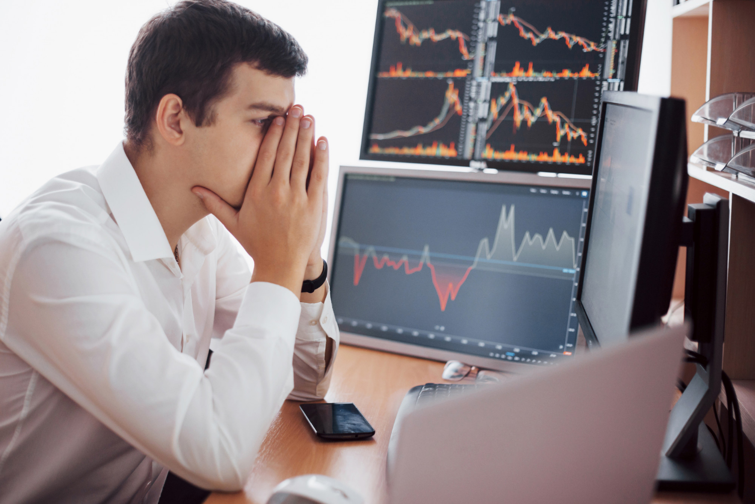 Trader reviewing stock charts, stock price action, learning to trade